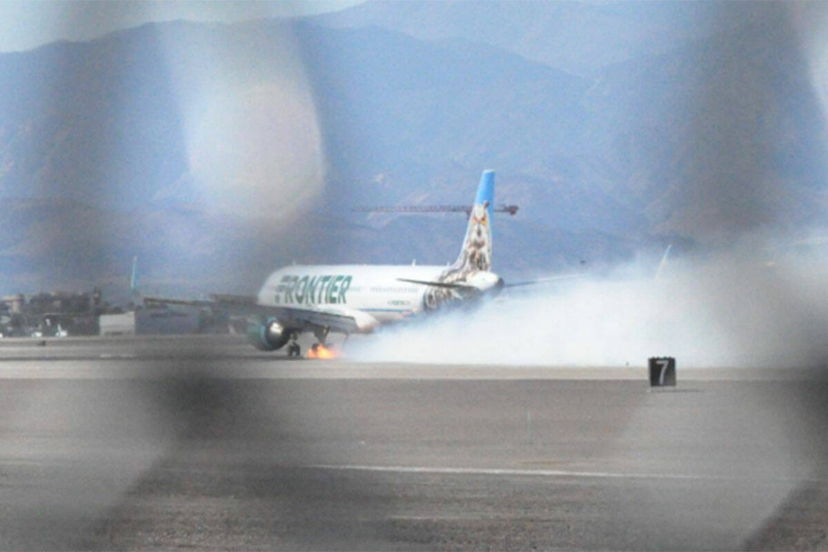 Photograph showing flames behind a Frontier Airlines plane on Oct. 5, 2024 at Harry Reid Intern ...