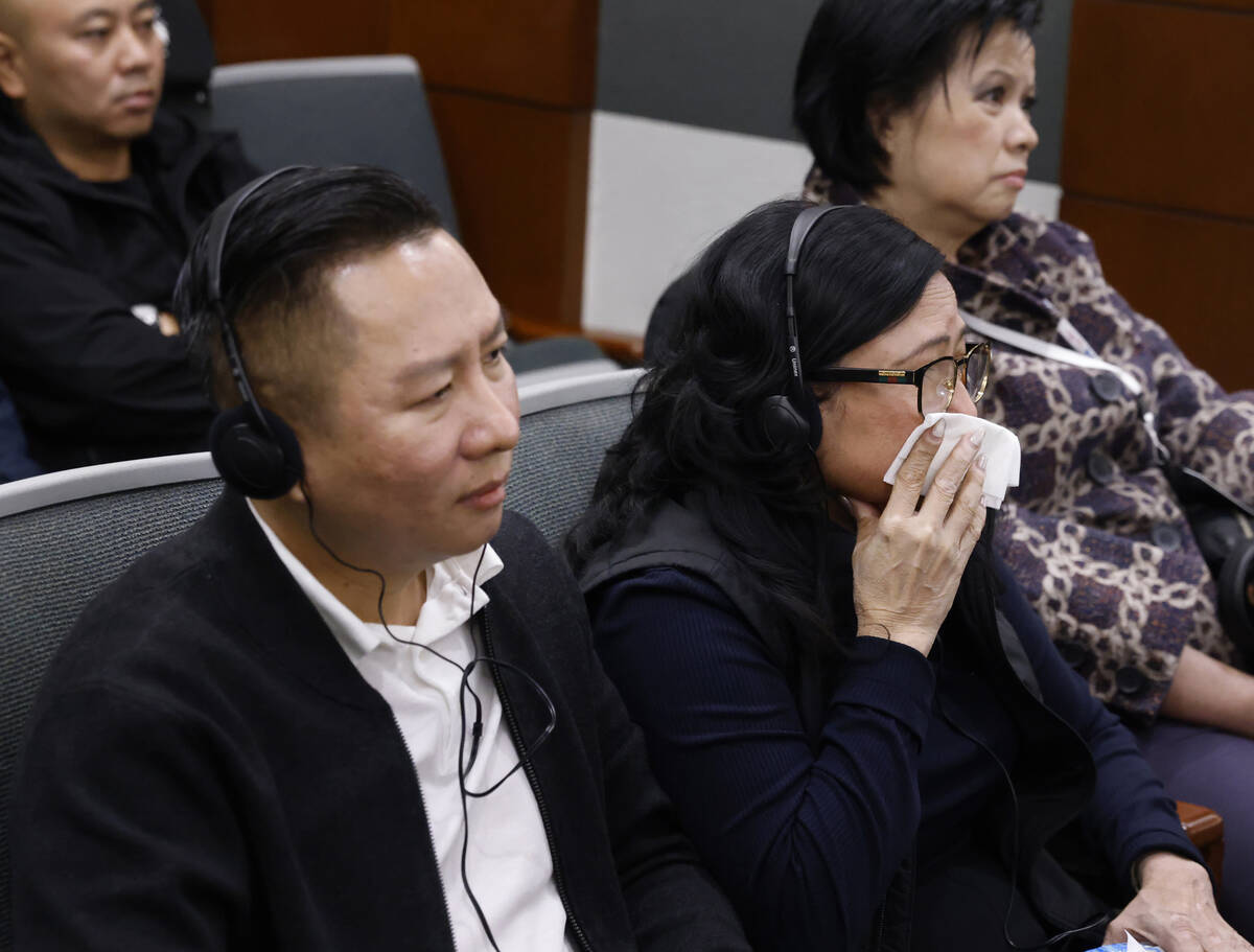 Hung Quang Nguyen, left, the husband of a stabbing victim Sang Nghia, and Bong Le, the mother o ...