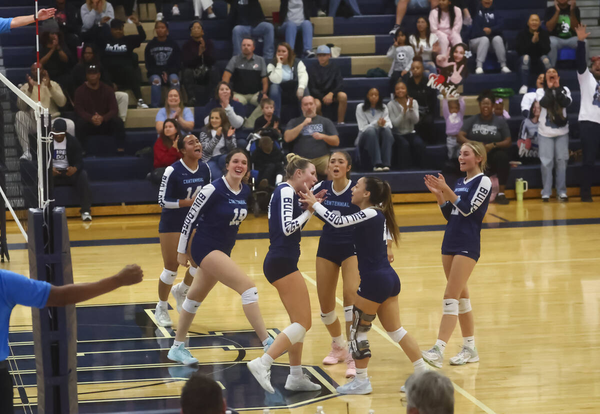 Centennial players celebrate after a play against Shadow Ridge during a Class 5A Southern Regio ...