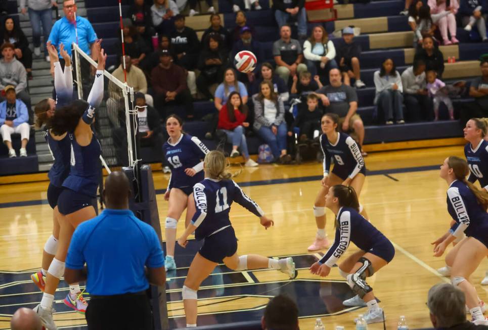 Shadow Ridge middle blocker Bree Farrimond, far left, and Lei Lasike (10) block the ball for th ...