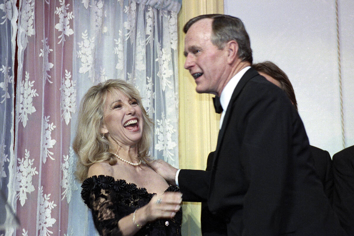 FILE - Actress Teri Garr is all smiles after being kissed by President Bush during a fundraisin ...