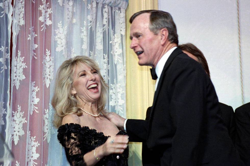 FILE - Actress Teri Garr is all smiles after being kissed by President Bush during a fundraisin ...