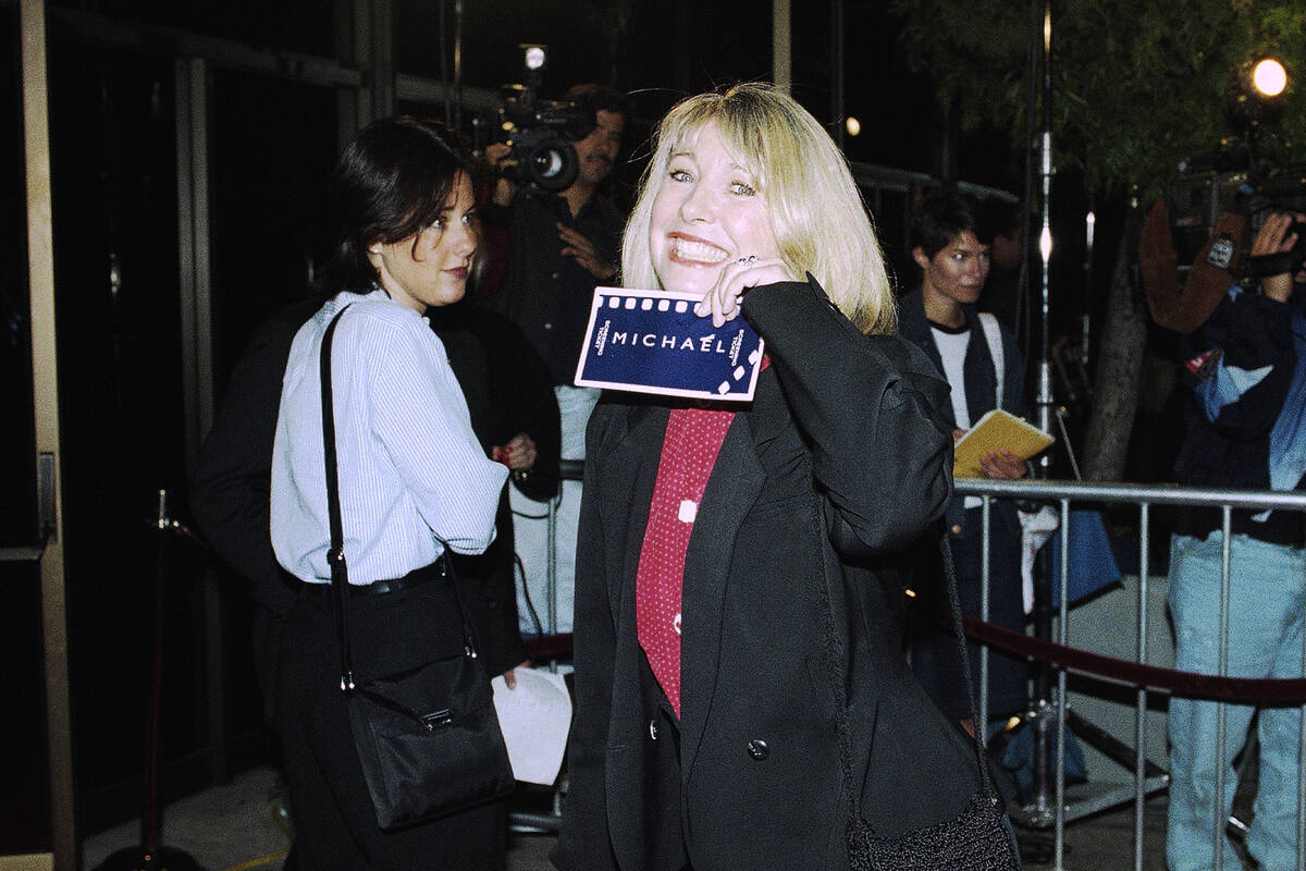 Actress Teri Garr shows off her ticket at the premiere of ?Michael," Dec. 19, 1996 in Beve ...