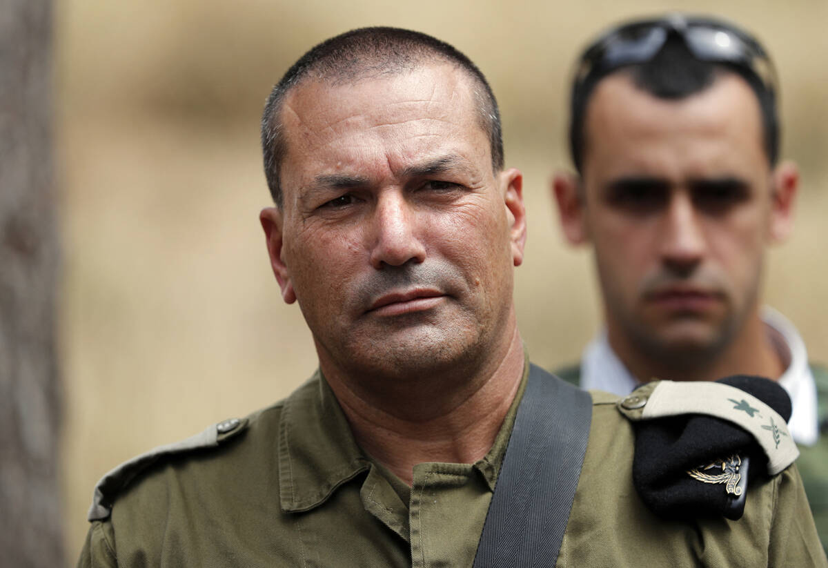 Israeli army major general Eyal Zamir, head of the southern command, looks on as he stands near ...