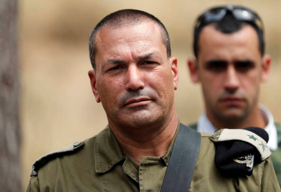 Israeli army major general Eyal Zamir, head of the southern command, looks on as he stands near ...