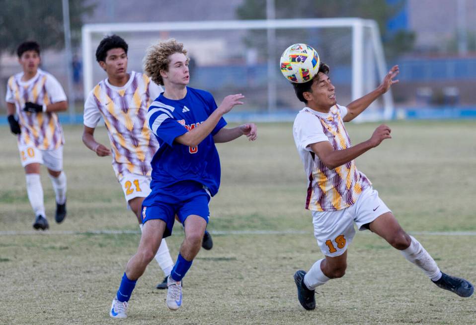 Eldorado senior Henyor Archila (18) headbutts the ball forward during the Class 5A Southern Lea ...