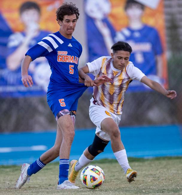 Bishop Gorman midfielder Benjamin Carpenter (5) and Eldorado sophomore Julian Suarez-Marin, rig ...