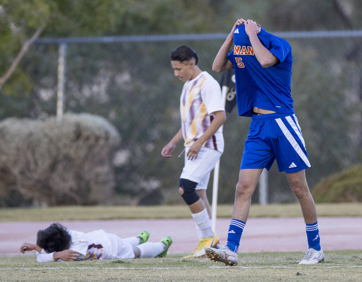 Bishop Gorman midfielder Benjamin Carpenter (5) reacts after kicking the ball out during the Cl ...