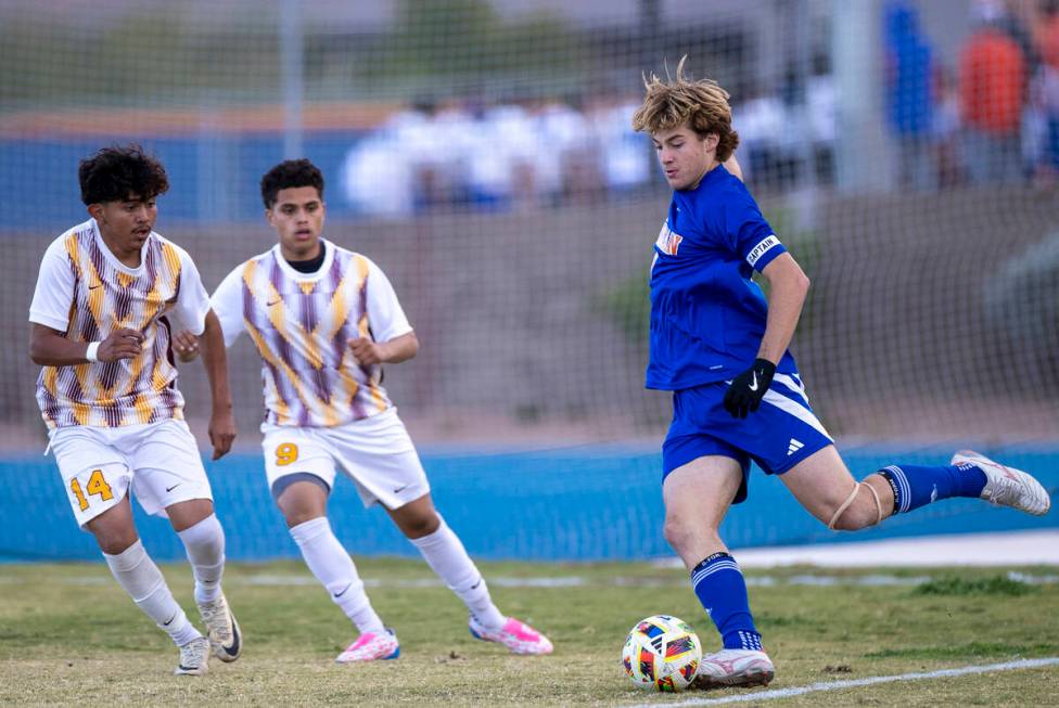 Bishop Gorman forward Chase Stewart (9) looks to kick the ball during the Class 5A Southern Lea ...