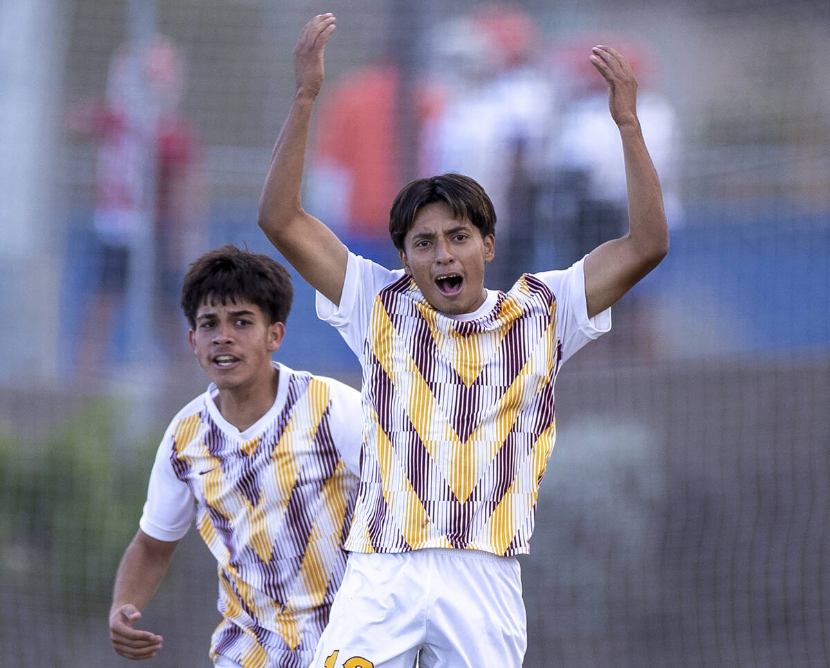 Eldorado senior Henyor Archila, right, celebrates scoring a goal during the Class 5A Southern L ...