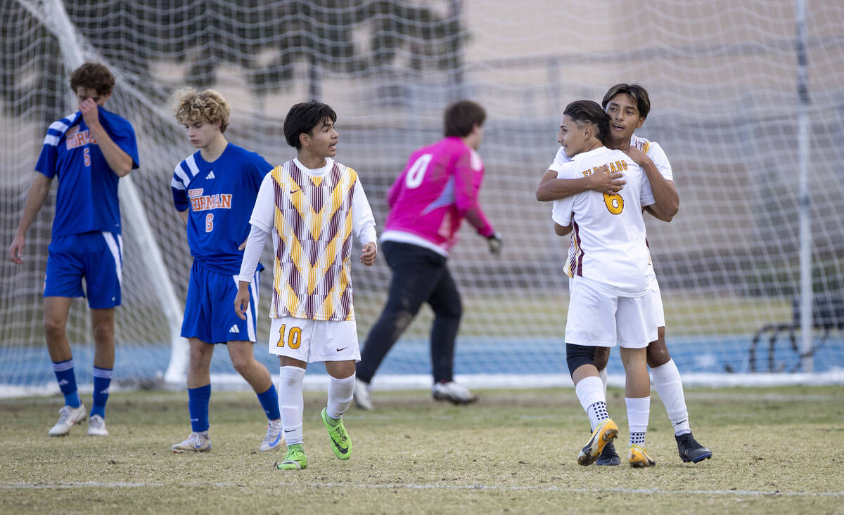 Eldorado senior Henyor Archila, back, hugs Eldorado sophomore Julian Suarez-Marin (6) after sco ...