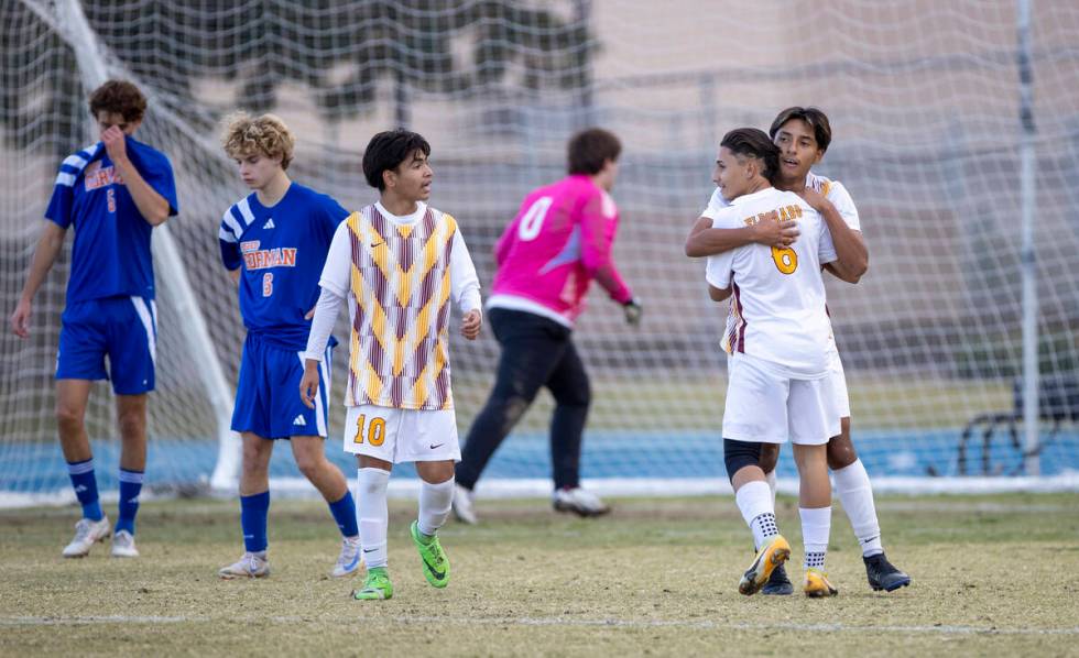 Eldorado senior Henyor Archila, back, hugs Eldorado sophomore Julian Suarez-Marin (6) after sco ...