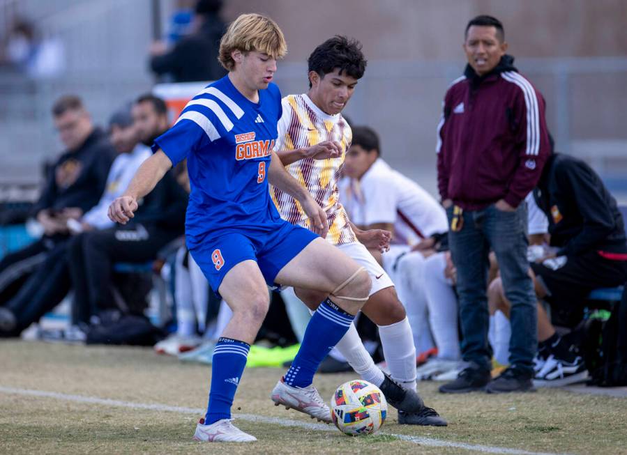 Bishop Gorman forward Chase Stewart (9) and Eldorado junior Jared Macedo, back, compete for the ...