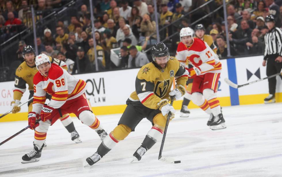 Golden Knights defenseman Alex Pietrangelo (7) skates with the puck against the Calgary Flames ...