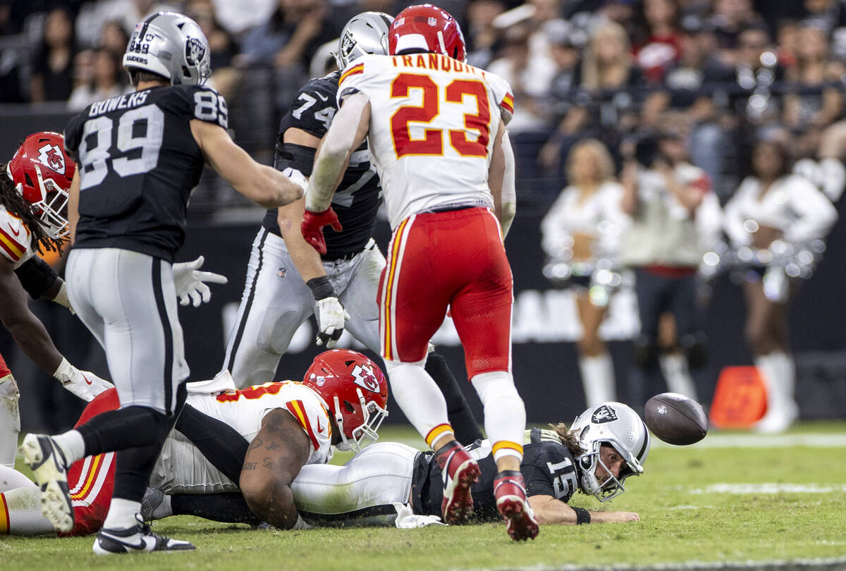 Raiders quarterback Gardner Minshew (15) fumbles the ball during the second half of the NFL foo ...