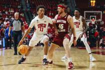 UNLV guard Dedan Thomas Jr. (11) drives the ball to the hoop while Boston College guard Mason M ...