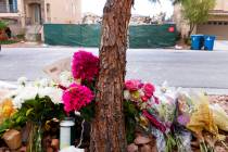 A makeshift memorial is seen in front of a now-mostly demolished house that burned to the groun ...