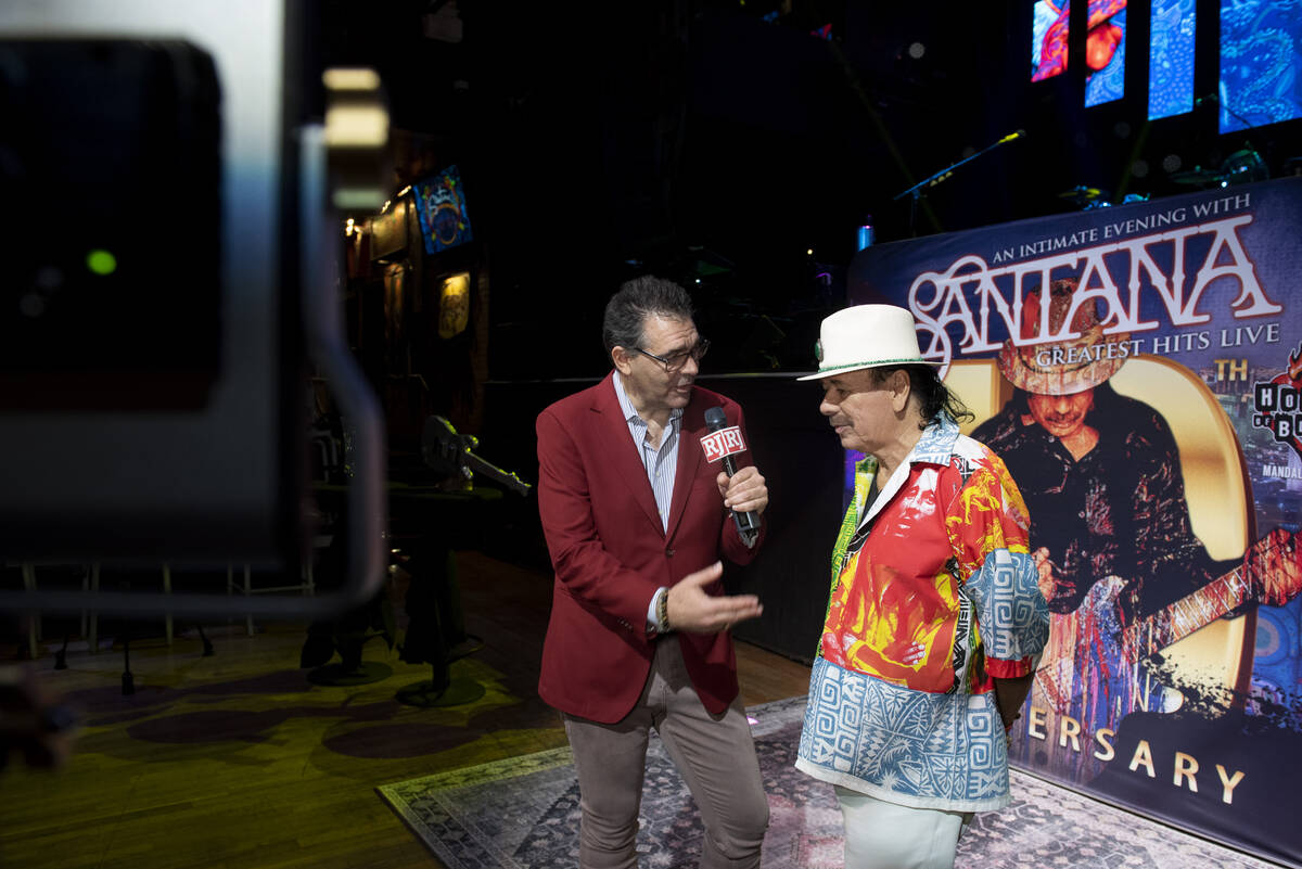 Carlos Santana talks to the Review-Journal's John Katsilometes during a press conference to ann ...