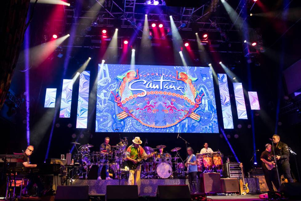 Carlos Santana performs a sound check after a press conference to announce an extension of Sant ...