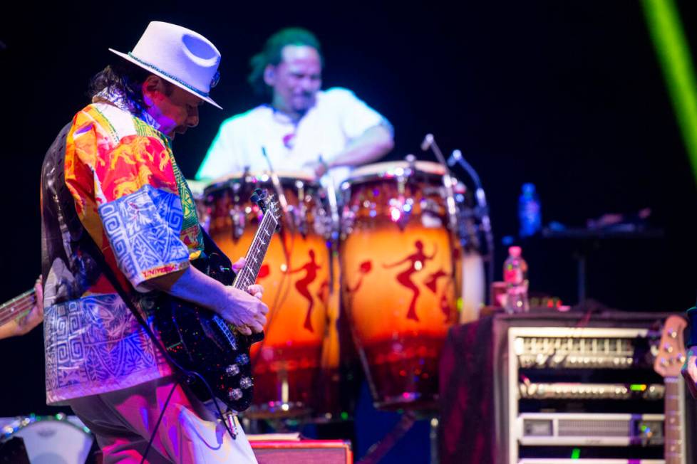 Carlos Santana performs a sound check after a press conference to announce an extension of Sant ...