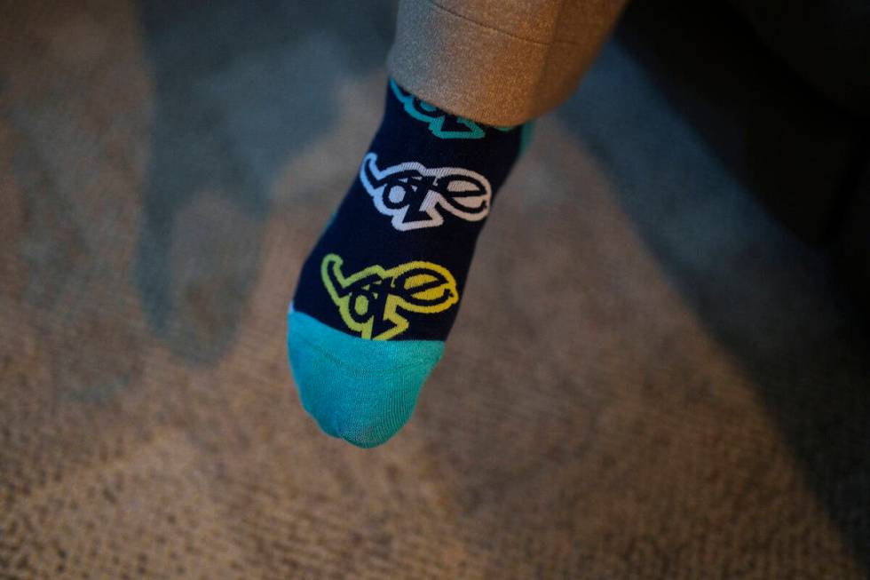 Cari-Ann Burgess, interim Registrar of Voters for Washoe County, Nev., wears socks with the wor ...