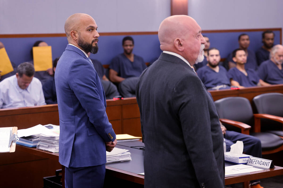 Metropolitan Police Department Sgt. Kevin Menon, left, appears in court with his attorney Domin ...