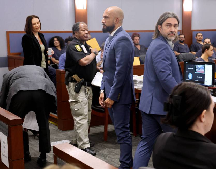 Metropolitan Police Department Sgt. Kevin Menon, center, appears in court for a bail hearing at ...