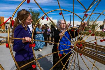 St. Jude’s Ranch for Children program development coordinator Annika Huff, left, looks o ...