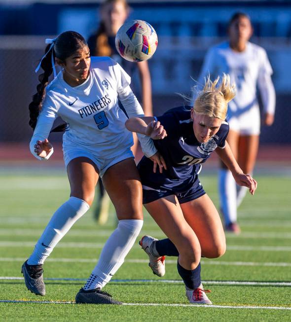 Centennial forward Skyley Mecham (20) and Canyon Springs defender Carolina Godoy (9) battle to ...