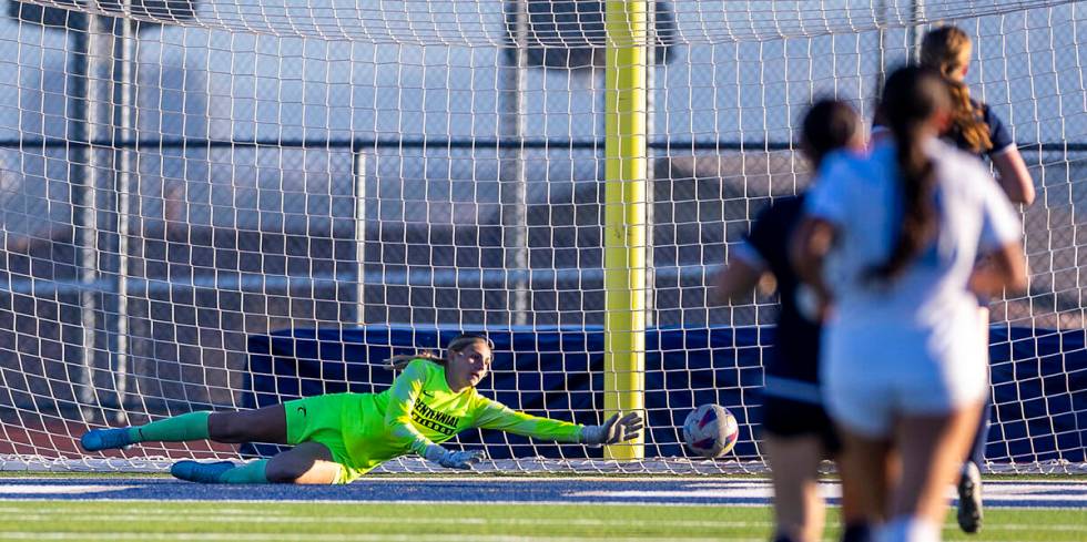 Centennial goalkeeper Madelyn Hartman (22) dives to deflect away a Canyon Springs scoring attem ...