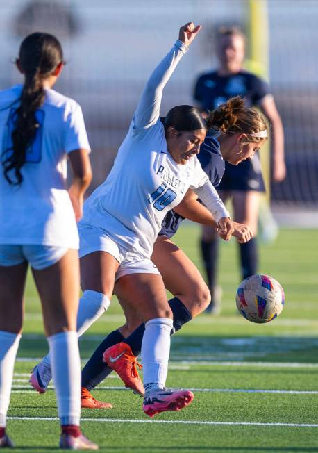 Canyon Springs midfielder Ximena Gonzalez (10) battles to control the ball against Centennial d ...