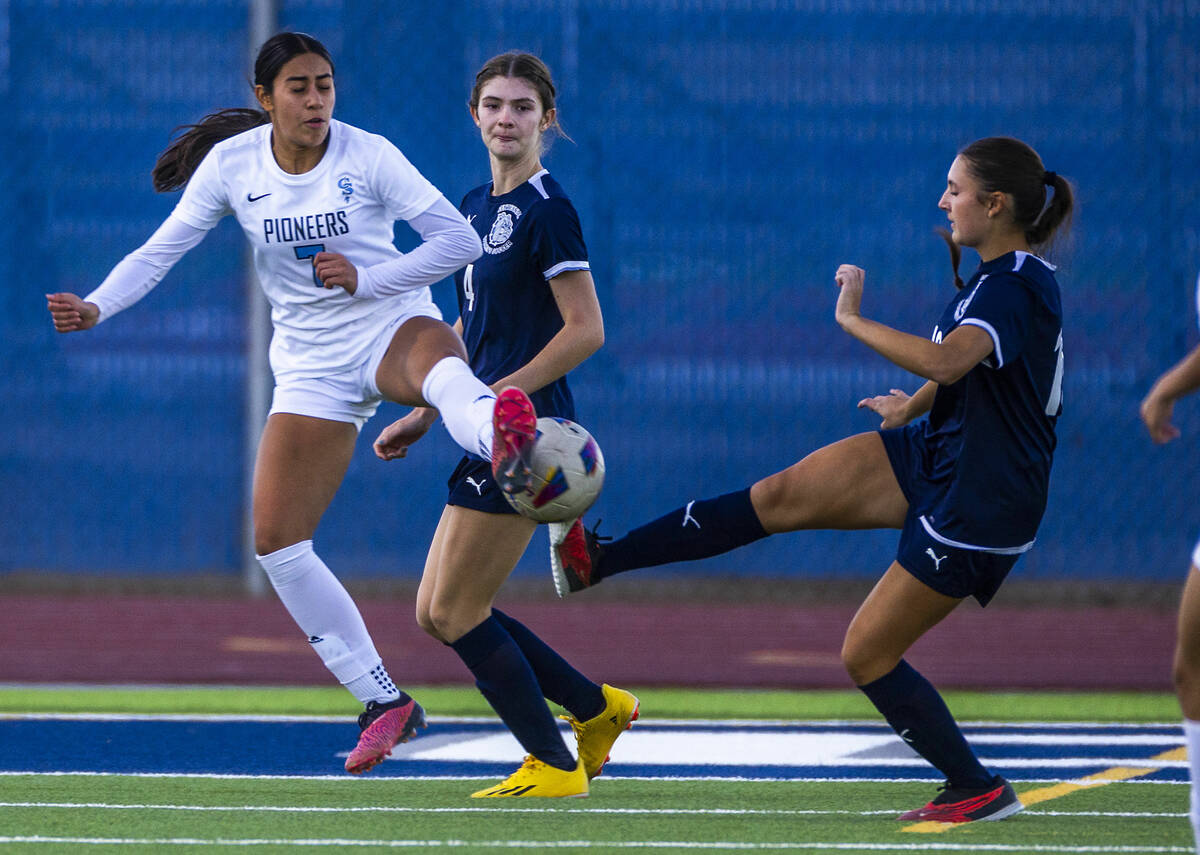 Centennial midfielder Julianne Donnelly (16) and Canyon Springs midfielder Daniela Mayorga (7) ...