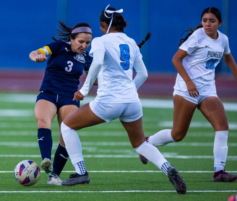 Centennial forward Natalie Sligar (3) passes the ball away from advancing Canyon Springs defend ...