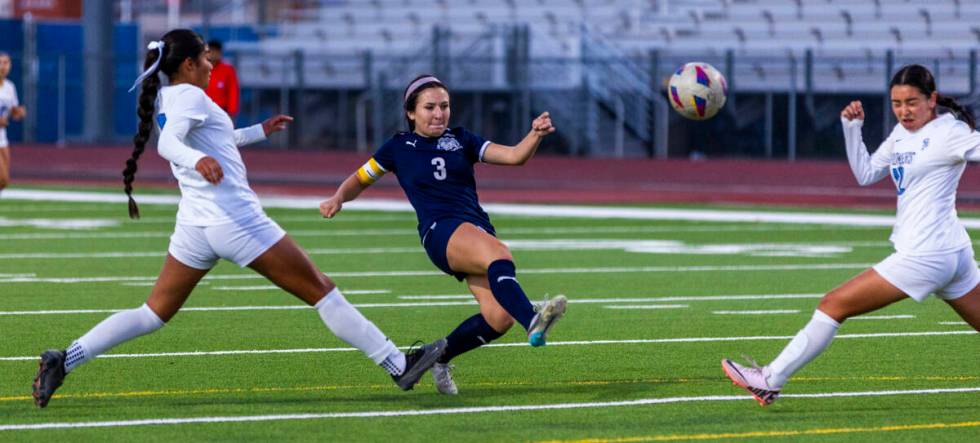 Canyon Springs defender Carolina Godoy (9) arrives late as Centennial forward Natalie Sligar (3 ...