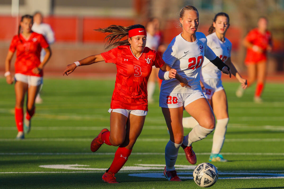 Arbor View forward Danielle Morales (3) and Coronado defender Cate Gusick (20) chase down the b ...