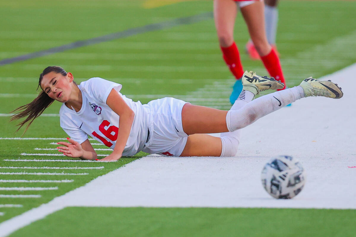 Coronado defender Mia Schlachter falls while chasing the ball during a Class 5A girls soccer qu ...