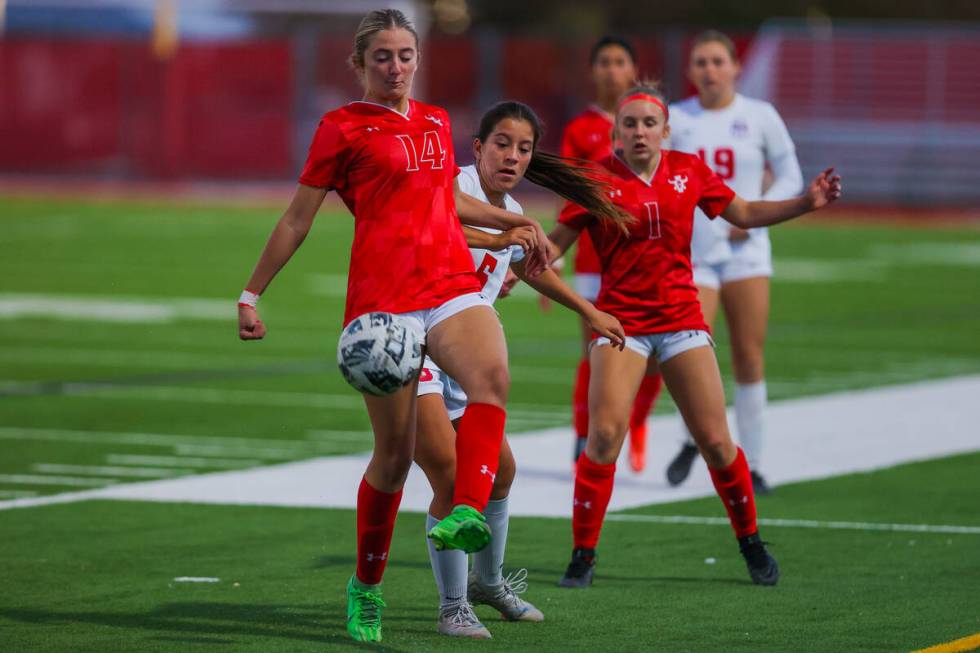 Arbor View’s Alyssa Hayward (14) kicks the ball out of bounds during a Class 5A girls so ...