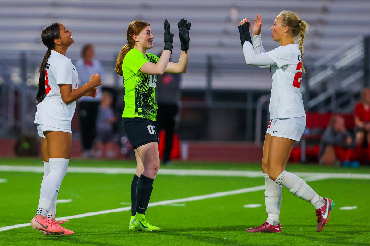 Coronado goalkeeper Emma Duda (00) celebrates a goal with teammate Cate Gusick (20) during a Cl ...