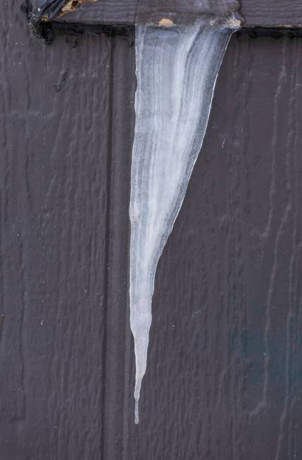 An icicle hangs from a maintenance building as snow is beginning to be made at Lee Canyon on Th ...