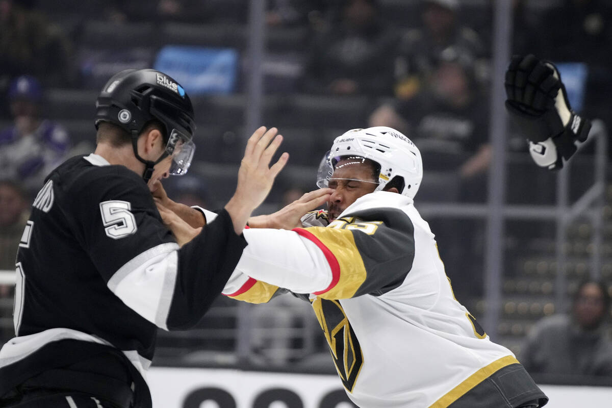 Los Angeles Kings' Andreas Englund, left, and Vegas Golden Knights' Keegan Kolesar fight during ...