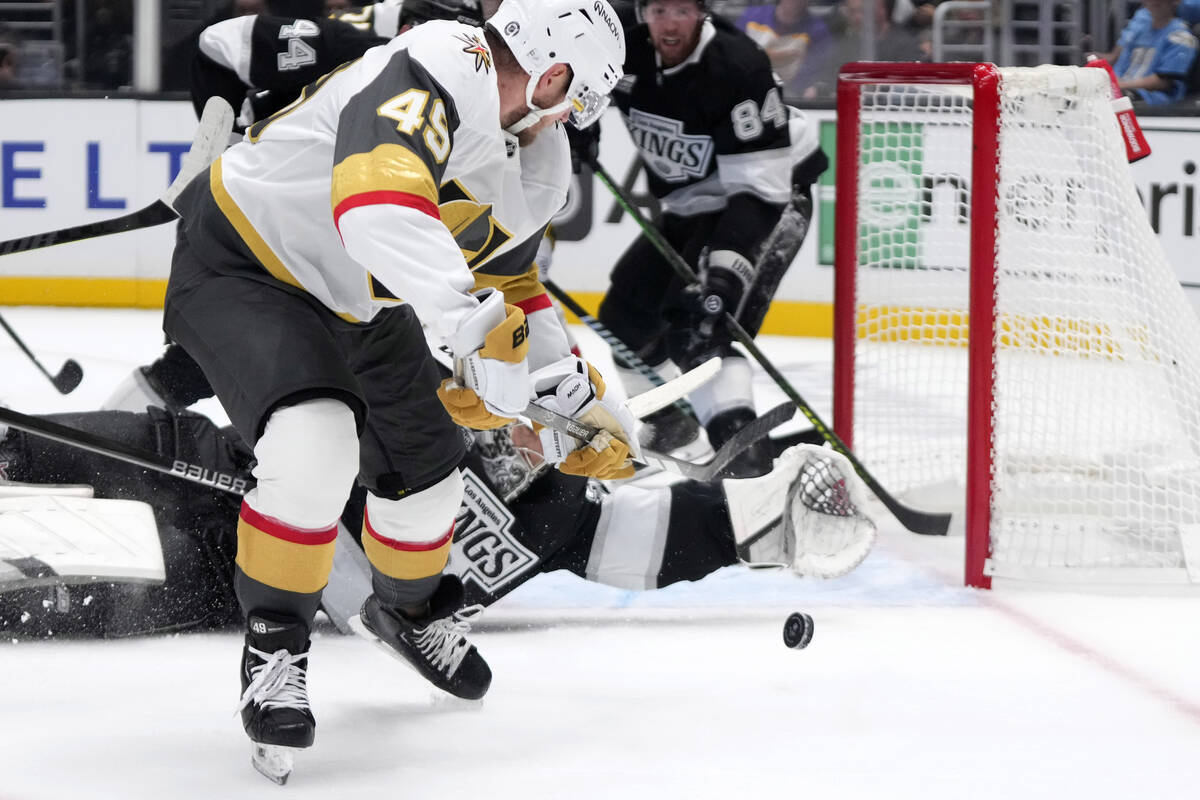 Vegas Golden Knights' Ivan Barbashev, left, tries to get a shot past Los Angeles Kings goalie D ...