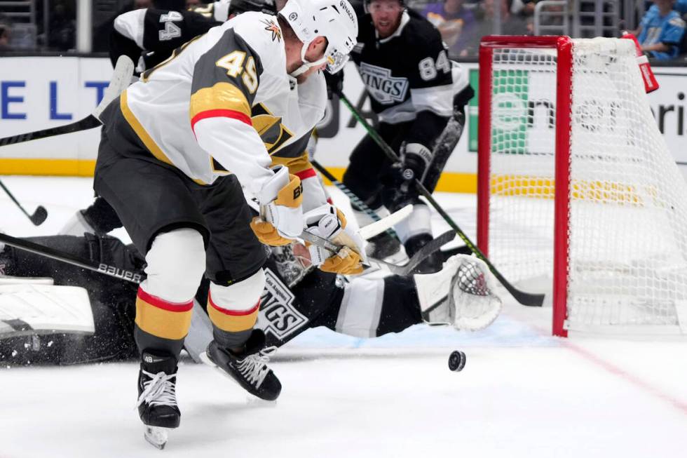 Vegas Golden Knights' Ivan Barbashev, left, tries to get a shot past Los Angeles Kings goalie D ...