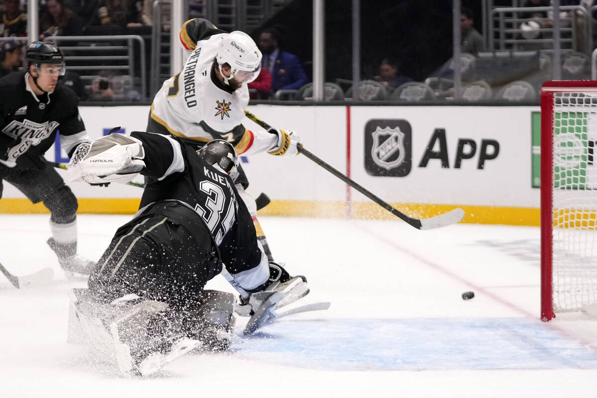 Vegas Golden Knights defenseman Alex Pietrangelo, top, tries to get a shot past Los Angeles Kin ...