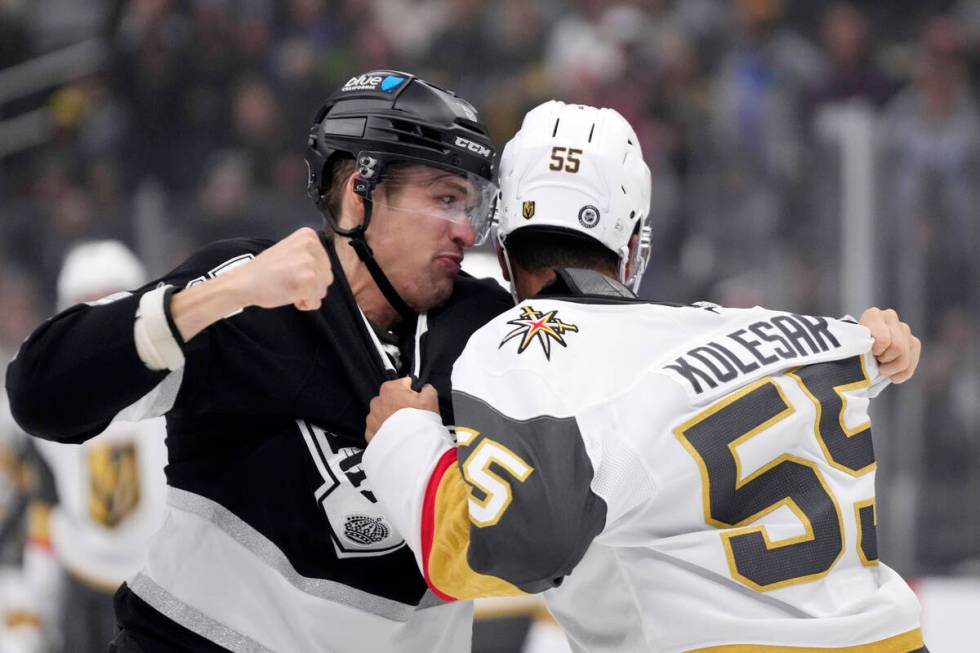 Los Angeles Kings' Andreas Englund, left, and Vegas Golden Knights' Keegan Kolesar fight during ...