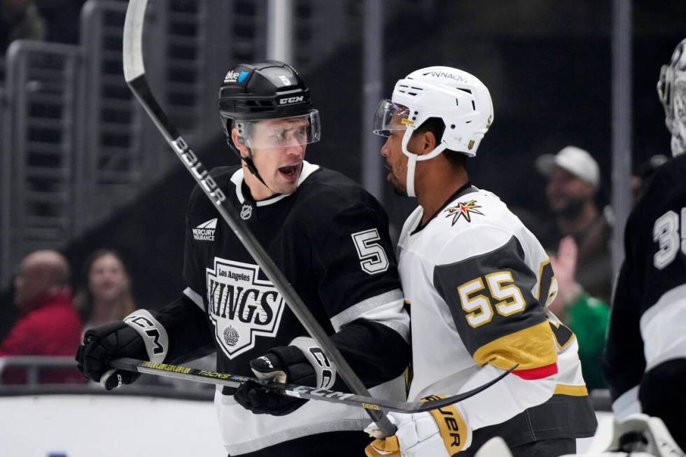 Los Angeles Kings' Andreas Englund, left, and Vegas Golden Knights' Keegan Kolesar jaw at each ...