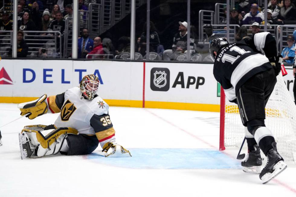 Los Angeles Kings center Anze Kopitar, right, scores on Vegas Golden Knights goaltender Ilya Sa ...