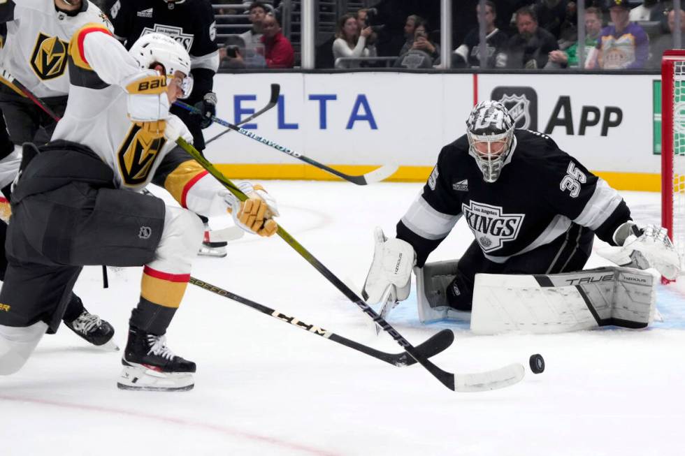 Vegas Golden Knights' Brett Howden, left, tries to get the puck past Los Angeles Kings goalie D ...