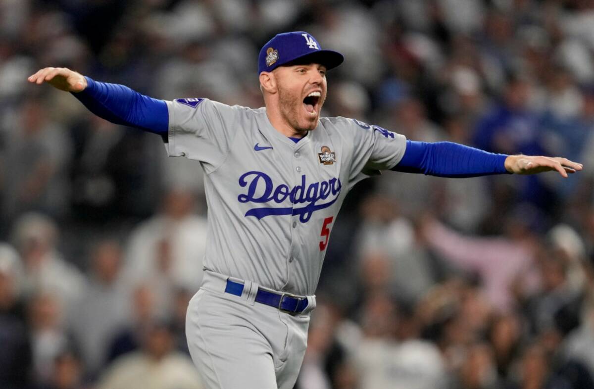 Los Angeles Dodgers first baseman Freddie Freeman celebrates their win against the New York Yan ...