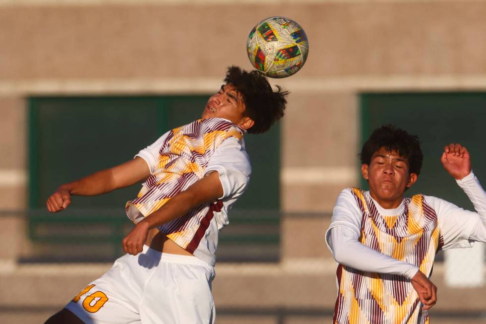 Eldorado's Abraham Chavez (10) heads the ball alongside Eldorado’s Jared Macedo while pl ...