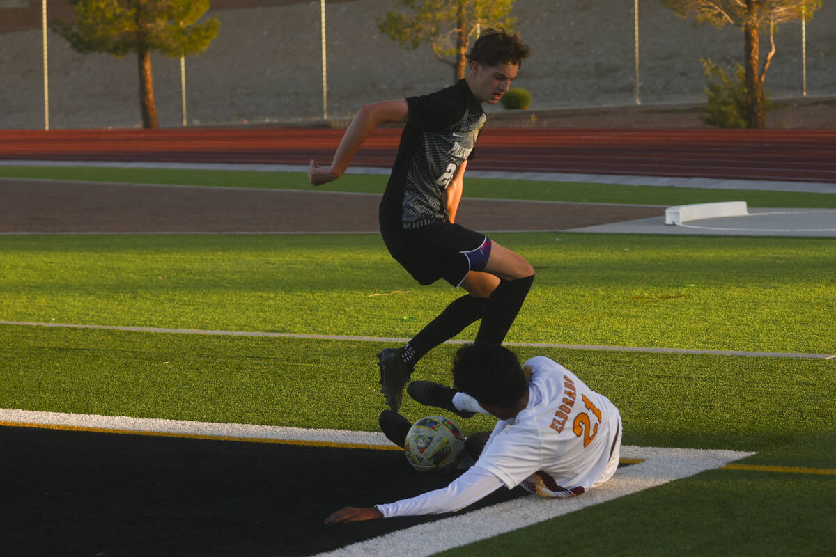 Eldorado’s Jared Macedo (21) slides to save the ball against Palo Verde midfielder Crew ...